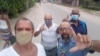José Díaz Silva (izq.) junto a otros miembros del MONR, durante una manifestación en La Güinera, Arroyo Naranjo. (Foto: Facebook)